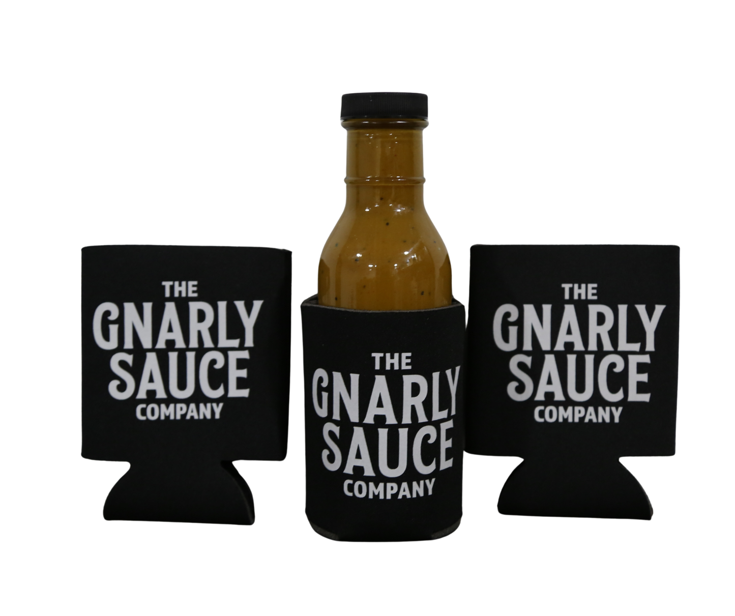 Bottle of 'The Gnarly Sauce Company' sauce with three black can coozies. Cookies are black with white Gnarly Sauce Company logo. 